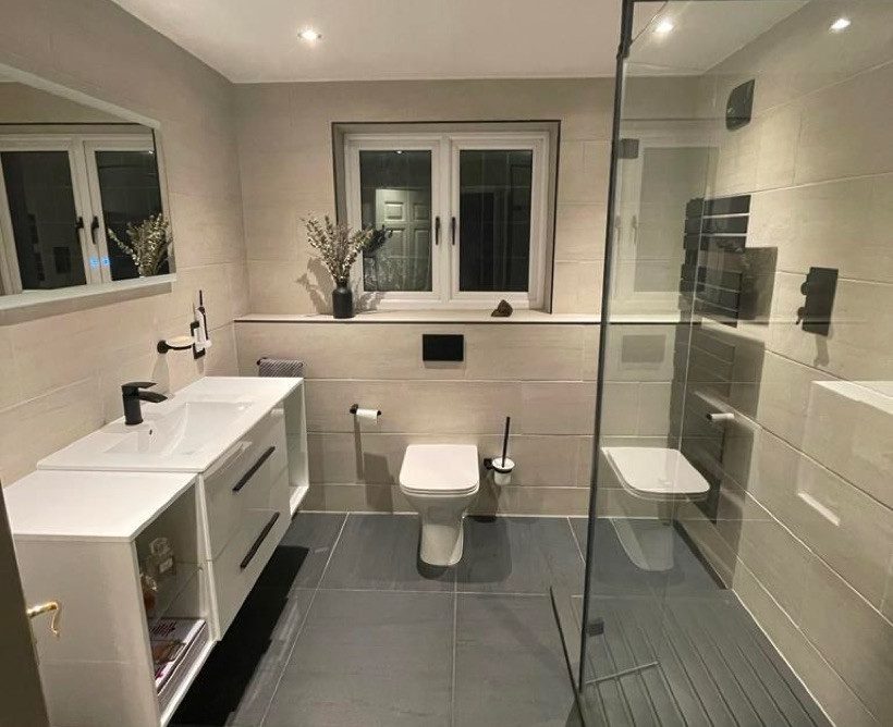 Photo of a sink, shower, and toilet in a modern bathroom that's been fitted in Southampton.
