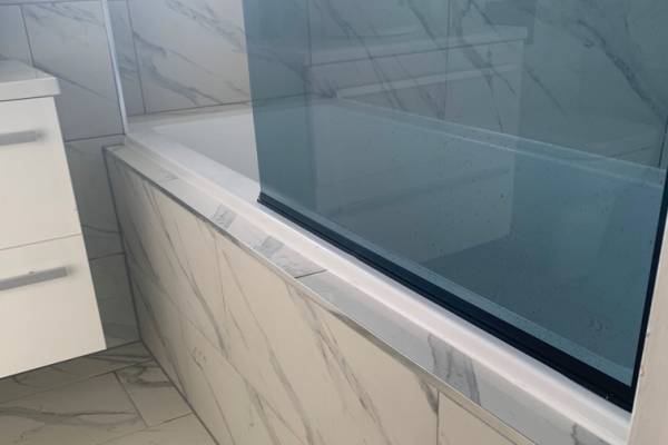 Photo of a marble bathtub that's been installed in a bathroom in Southampton.