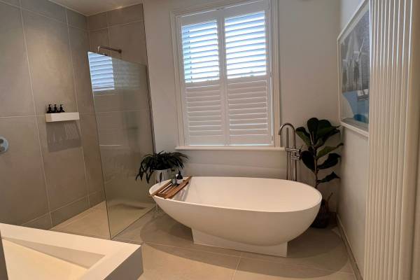 Photo of a new, white, modern bathroom that's been fitted in Southampton.